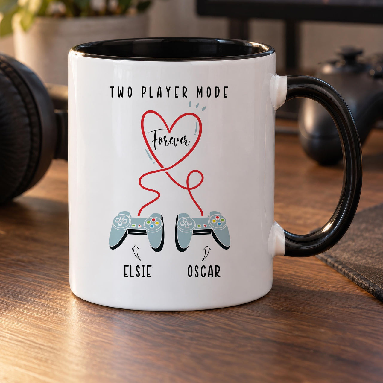 Personalised two player mug: black-handled mug with TWO PLAYER MODE, a red Forever heart, two controllers and names