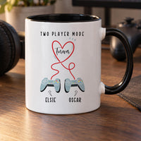 Personalised two player mug: black-handled mug with TWO PLAYER MODE, a red Forever heart, two controllers and names