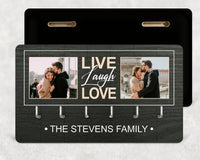 Dark wood-effect key holder with two couple photos, 