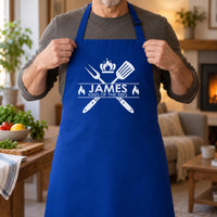 Man holding the straps of a royal blue apron printed 