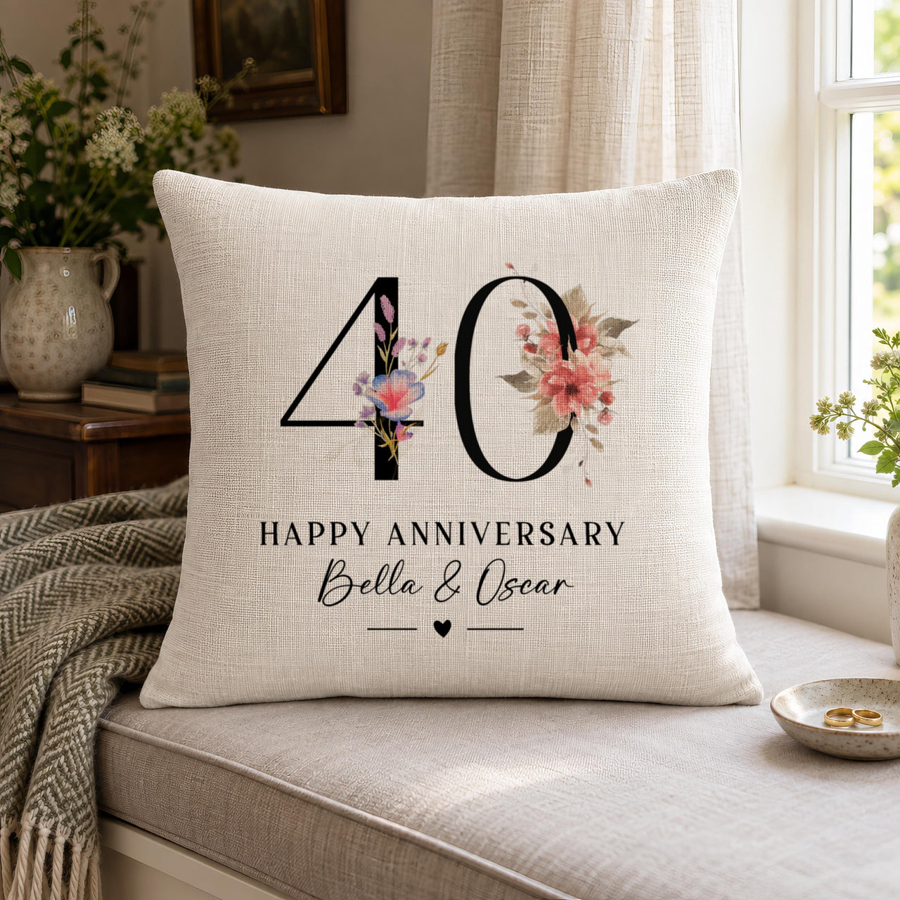 Linen cushion with a large "40" decorated with pink flowers and "Happy Anniversary Bella & Oscar" - personalised cushion