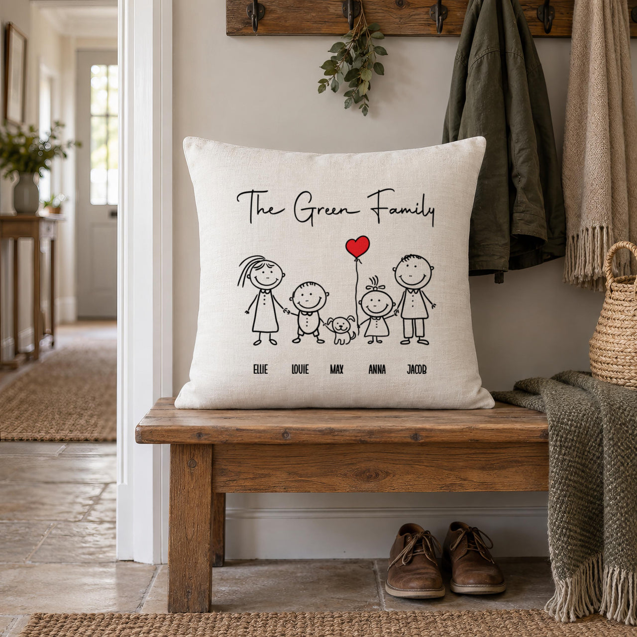 Linen-look 'The Green Family' cushion with stick figures, dog and heart balloon on a hall bench - personalised cushion