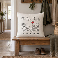 Linen-look 'The Green Family' cushion with stick figures, dog and heart balloon on a hall bench - personalised cushion