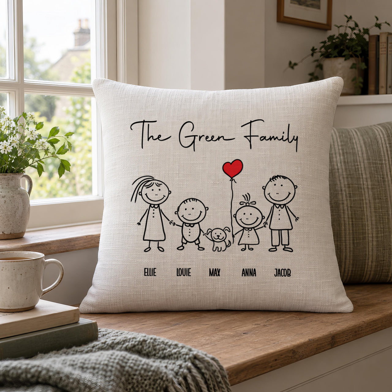 Linen-look stick figure family cushion with dog and red heart balloon on a window seat - personalised cushion