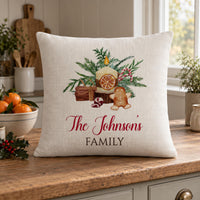 Linen cushion with candle, gingerbread man and pine artwork, red 'The Johnson's' and 'FAMILY' text - personalised cushion