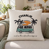 Linen-look campervan cushion 'CHARLIE', 'and so the adventure begins', on a cream sofa with gifts - personalised cushion