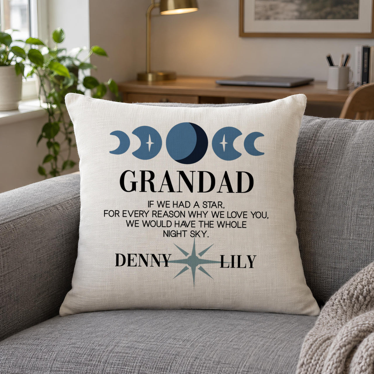 Linen-look moon phases cushion 'GRANDAD' with names 'DENNY' and 'LILY' on a grey sofa - personalised cushion