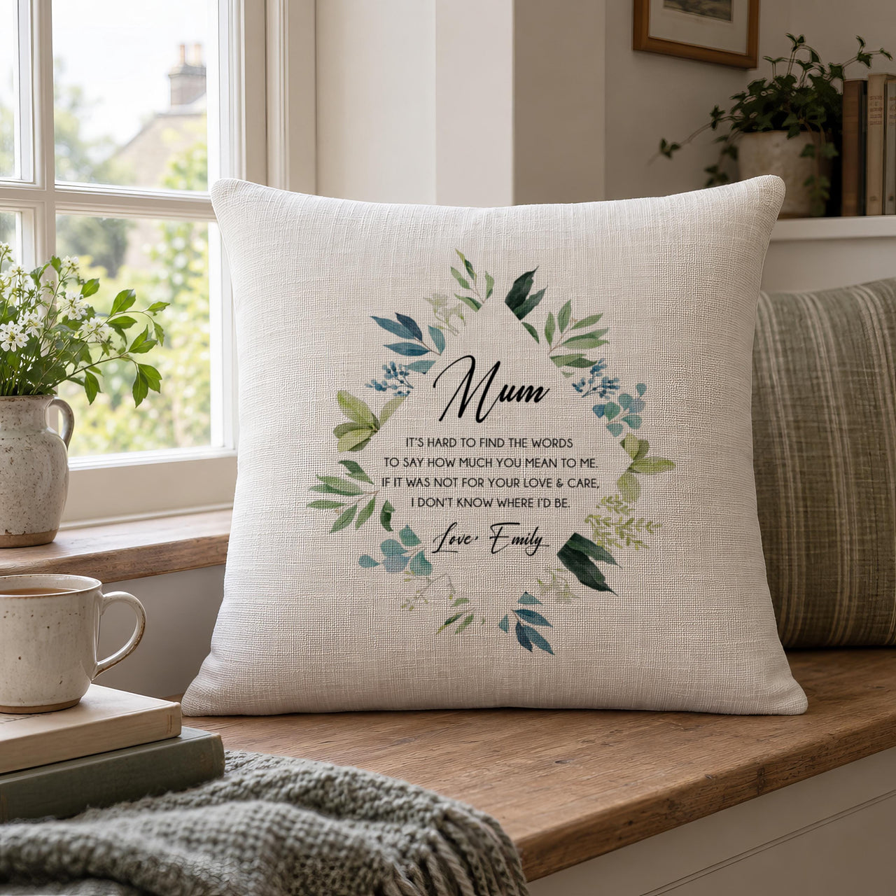 Linen-look cushion with 'Mum' poem in a leaf wreath, signed 'Love, Emily', on a window seat - personalised cushion