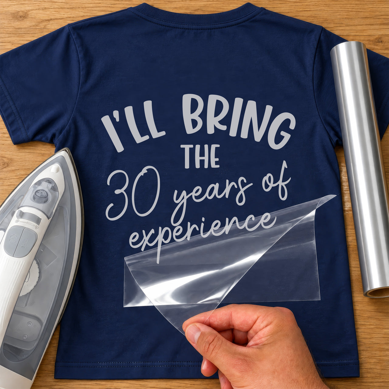Back of a navy T-shirt with silver 'I'LL BRING THE 30 years of experience', film peeled off - iron-on vinyl transfer