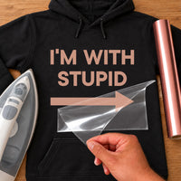 Black hoodie with 'I'M WITH STUPID' and a right arrow in rose gold vinyl, iron-on vinyl transfer