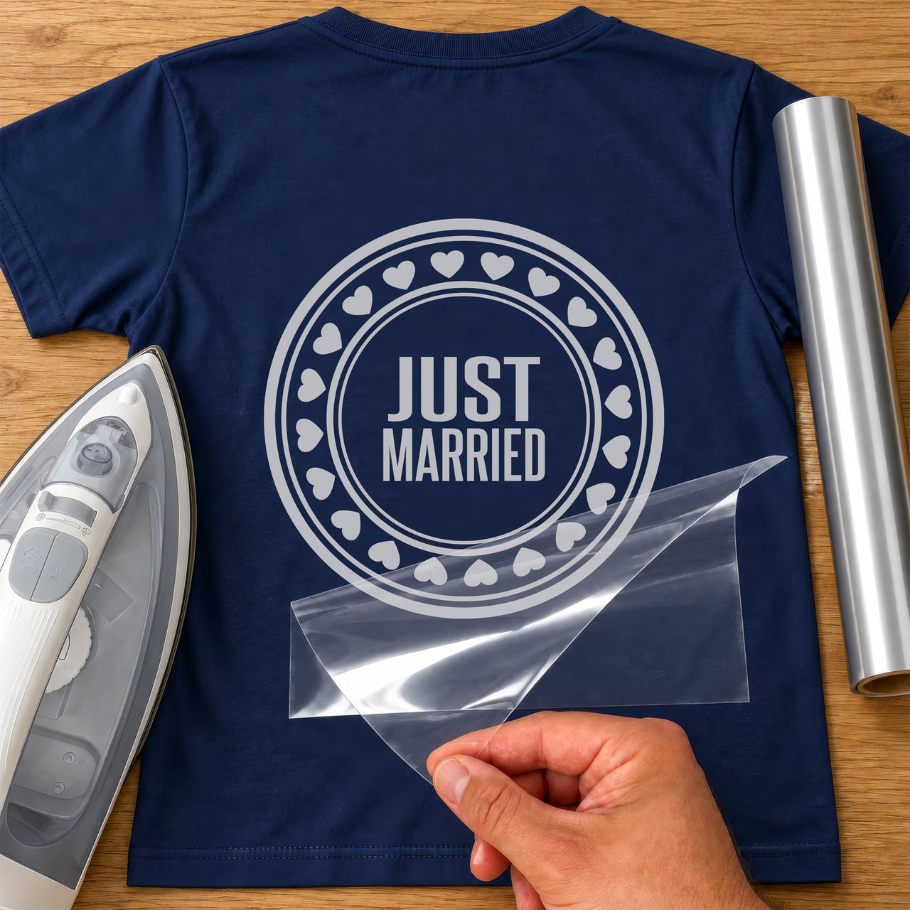Navy T-shirt with silver round stamp, 'JUST MARRIED' inside a ring of hearts, wedding iron-on vinyl transfer