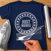 Navy T-shirt with silver round stamp, 'JUST MARRIED' inside a ring of hearts, wedding iron-on vinyl transfer