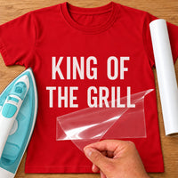 Mockup: red T-shirt with white vinyl 'King of the Grill' in tall capitals, iron and transfer sheet alongside