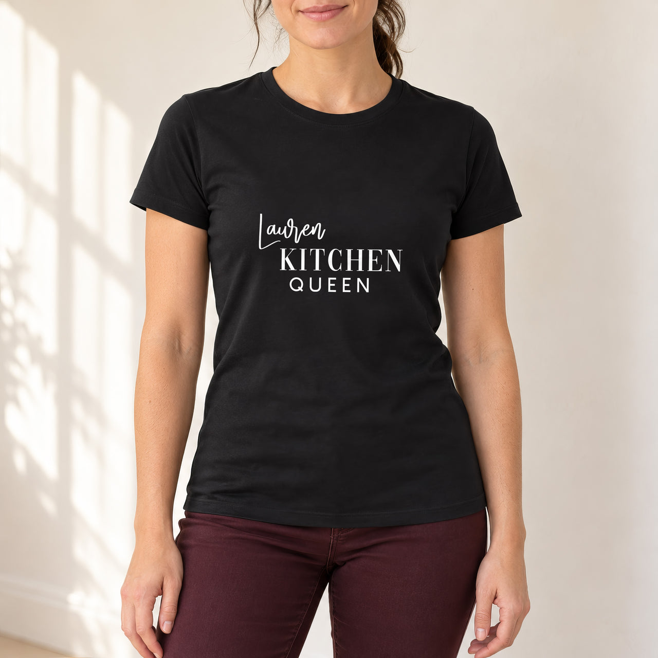 Kitchen Queen Iron-On Transfer - Personalised Name On Top, shown on a black t-shirt