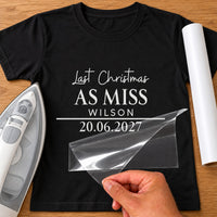 Black T-shirt with white 'Last Christmas AS MISS WILSON 20.06.2027' lettering - personalised iron-on vinyl transfer