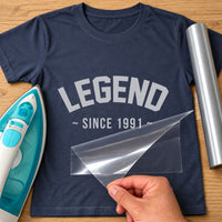 Navy T-shirt mockup with arched silver 'LEGEND' and '~ SINCE 1991 ~' applied as iron-on vinyl transfer