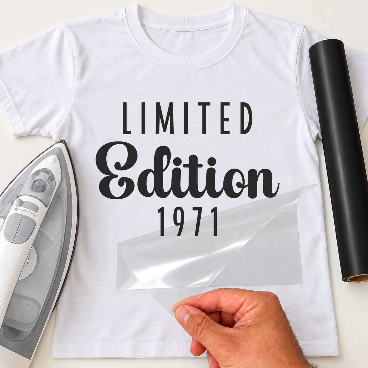 White T-shirt with black 'LIMITED' capitals, 'Edition' script and '1971' iron-on transfer, iron and black vinyl roll