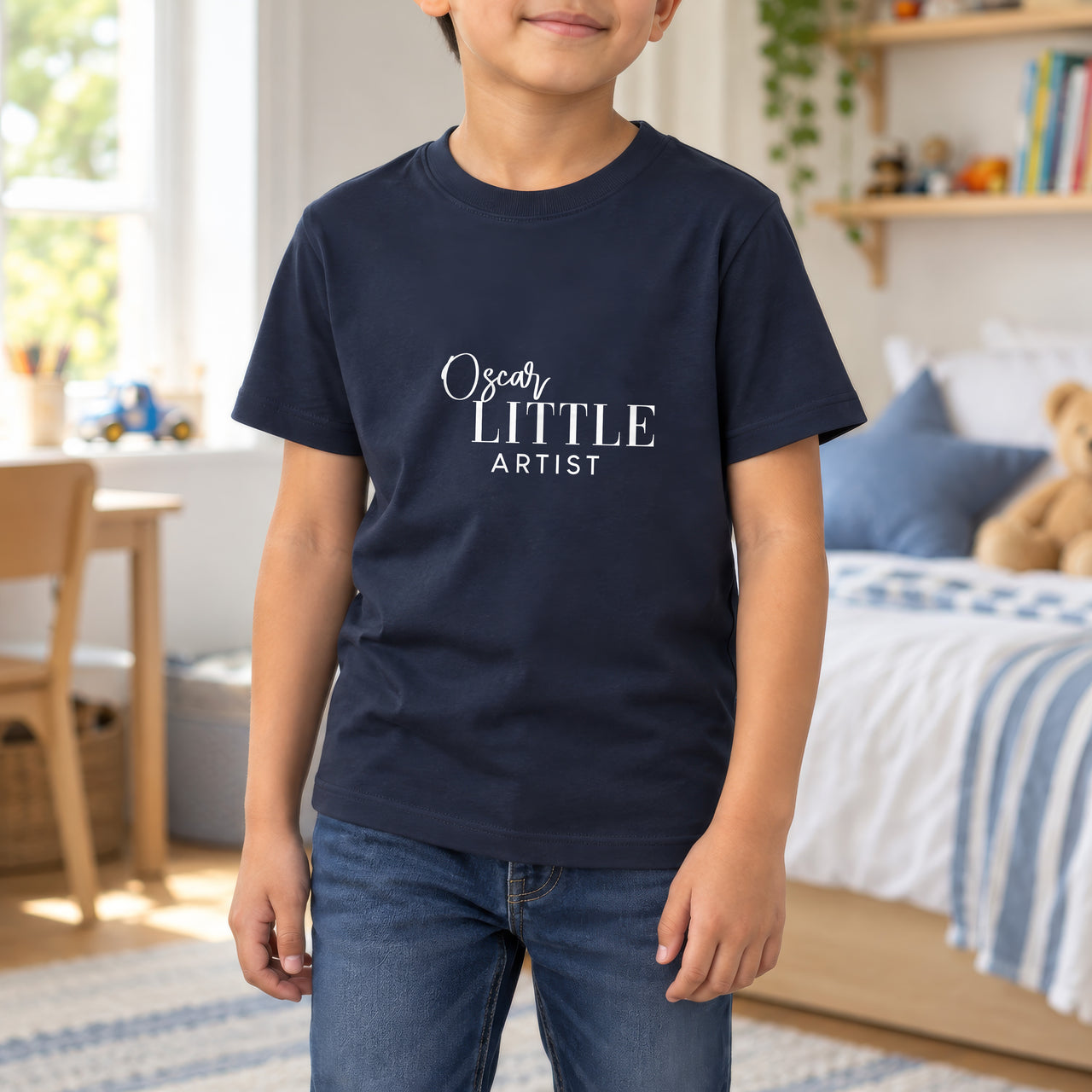 Little Artist Iron-On Transfer - Personalised Name Design, shown on a navy kids t-shirt