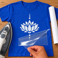 Lotus flower iron-on transfer: white lotus with dotted line on a blue T-shirt, film being peeled