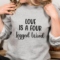 Love Is A Four Legged Word Iron-On Transfer shown on a sweatshirt