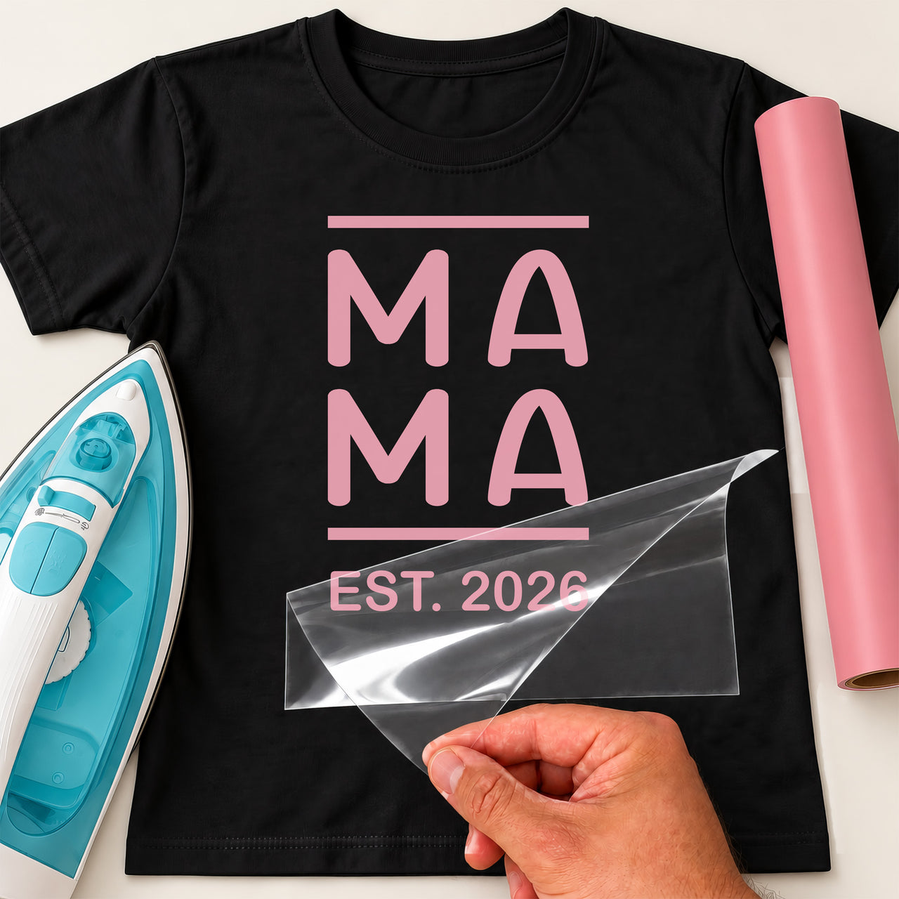 Black T-shirt with pink stacked 'MA MA' between bars and 'EST. 2026', Mama Est. iron-on transfer