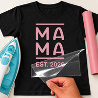 Black T-shirt with pink stacked 'MA MA' between bars and 'EST. 2026', Mama Est. iron-on transfer