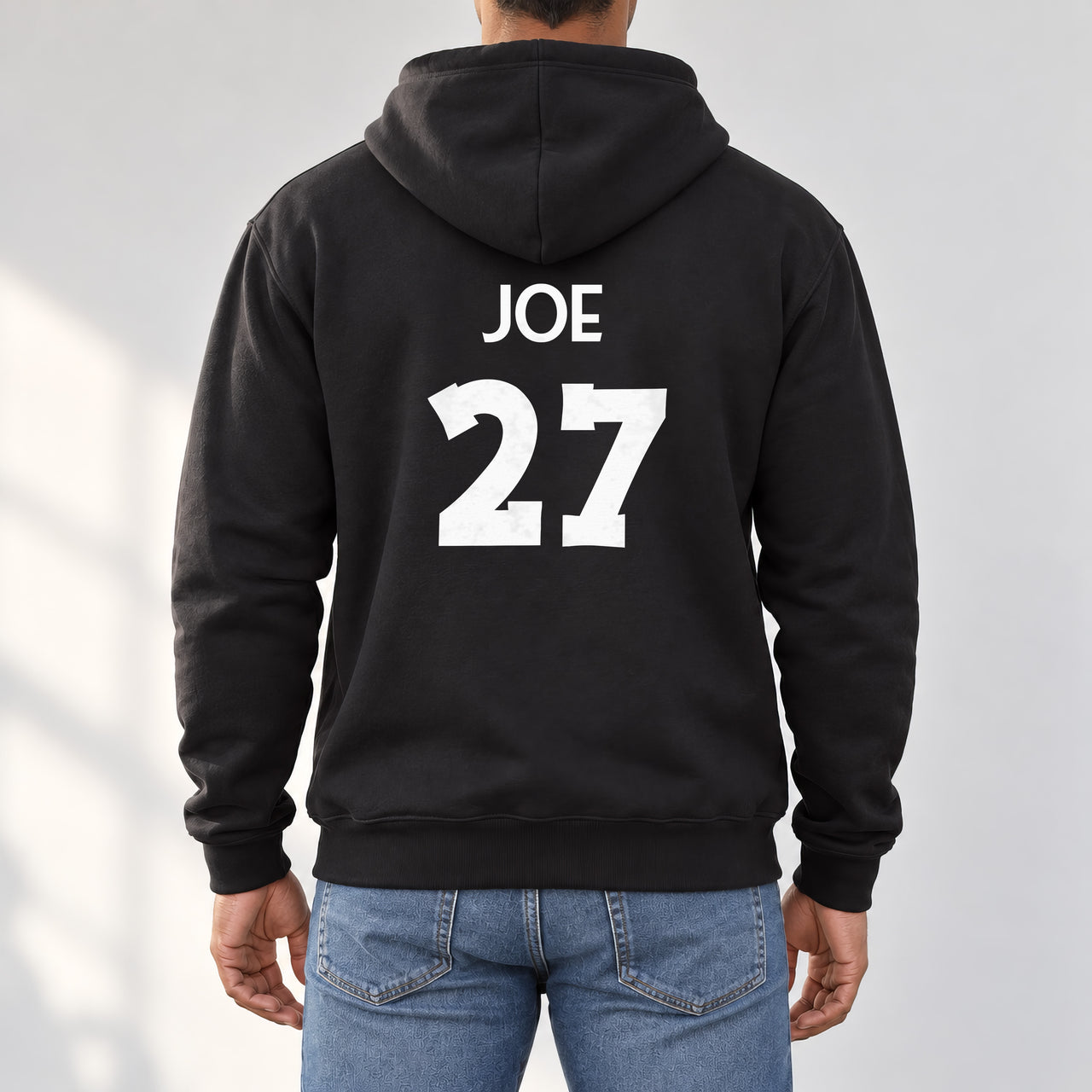 Black hoodie with the Martial Arts Name and Number design printed on the back