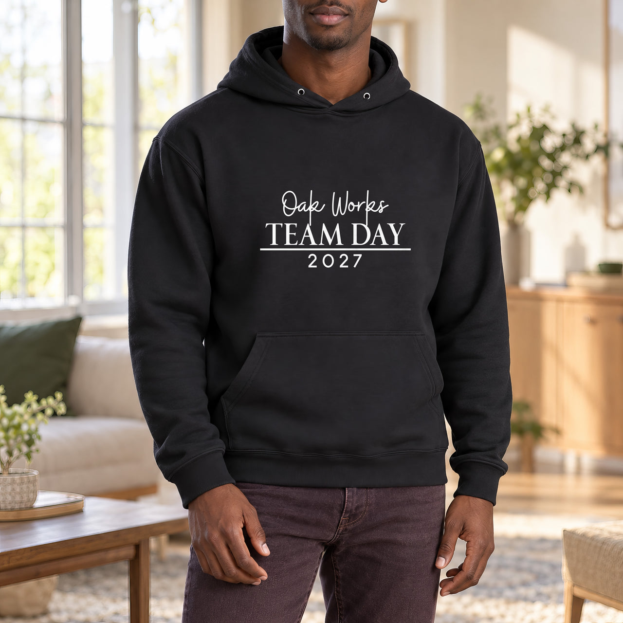 Iron On Corporate Text, shown on a black hoodie