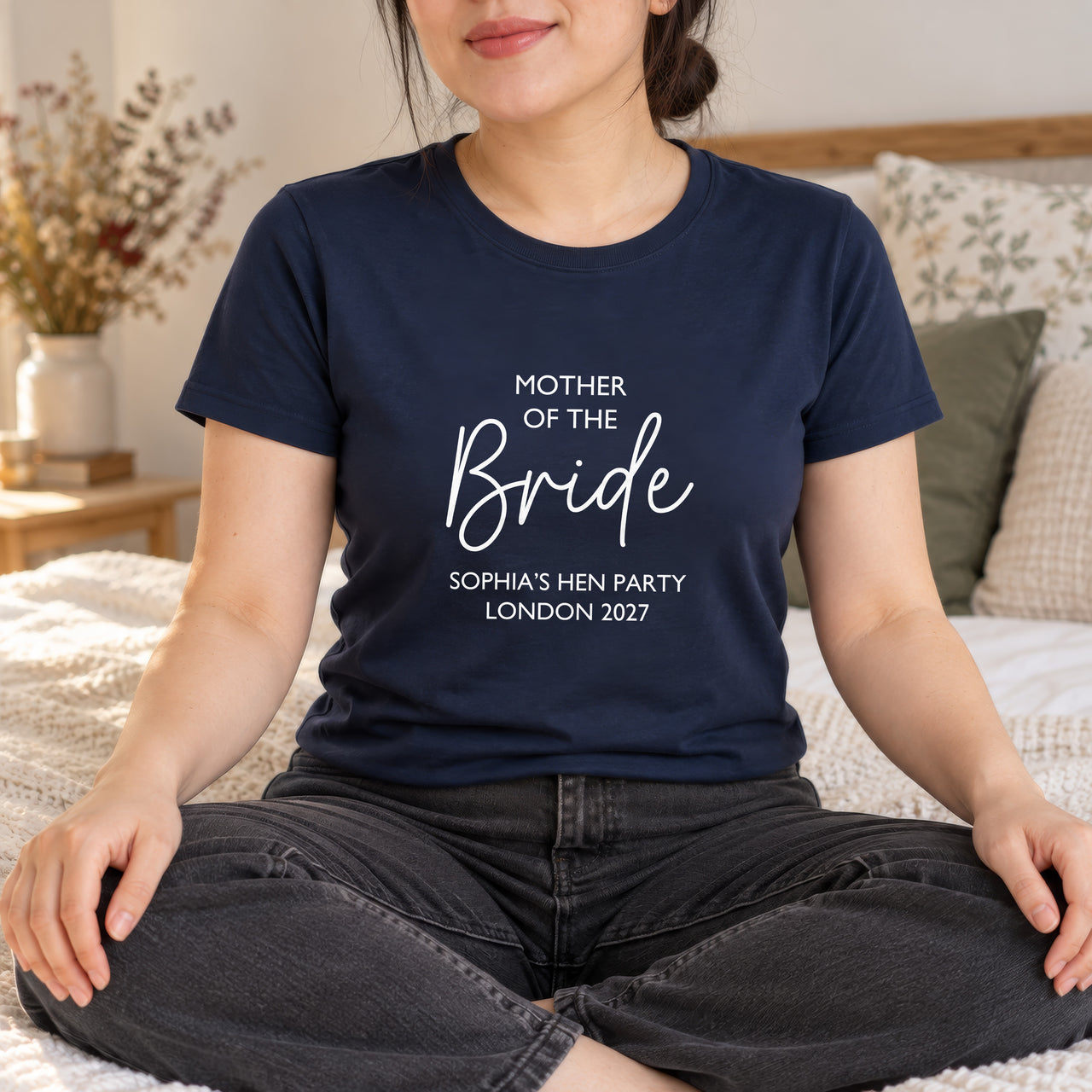 Navy T-shirt with the Mother of the Bride Script Hen Weekend design printed on the chest