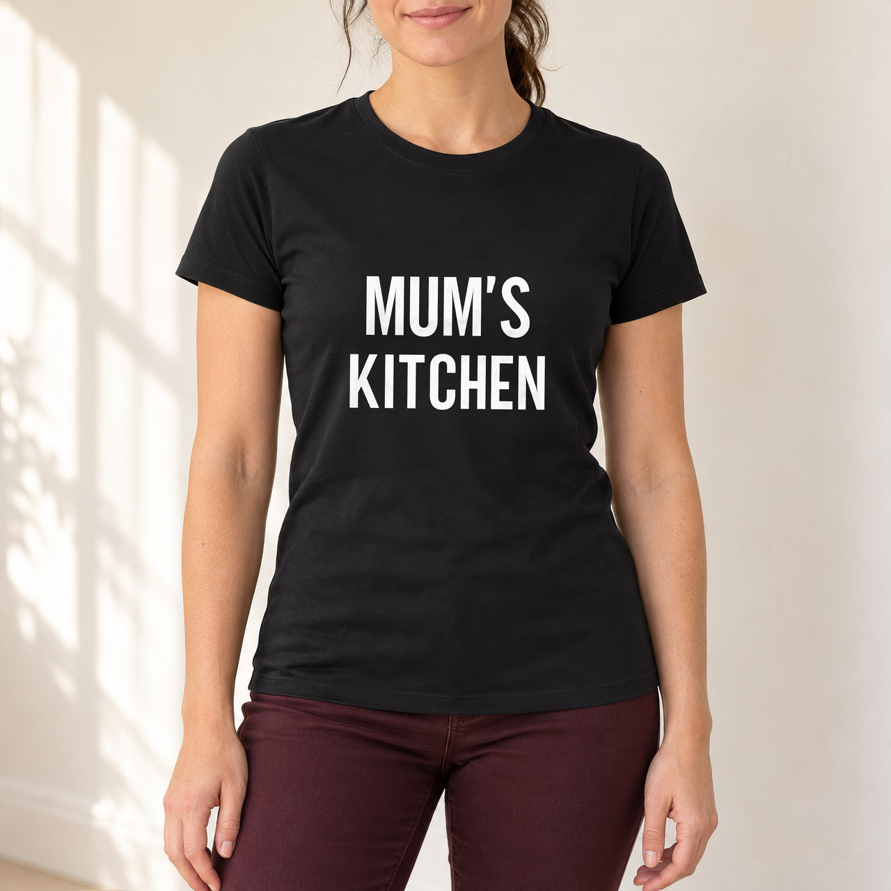 Black T-shirt with the Mum's Kitchen design printed on the chest