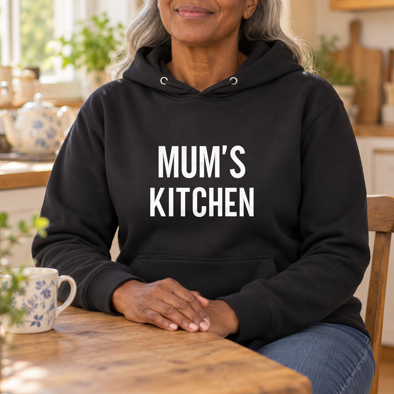 Black hoodie with the Mum's Kitchen design printed on the chest