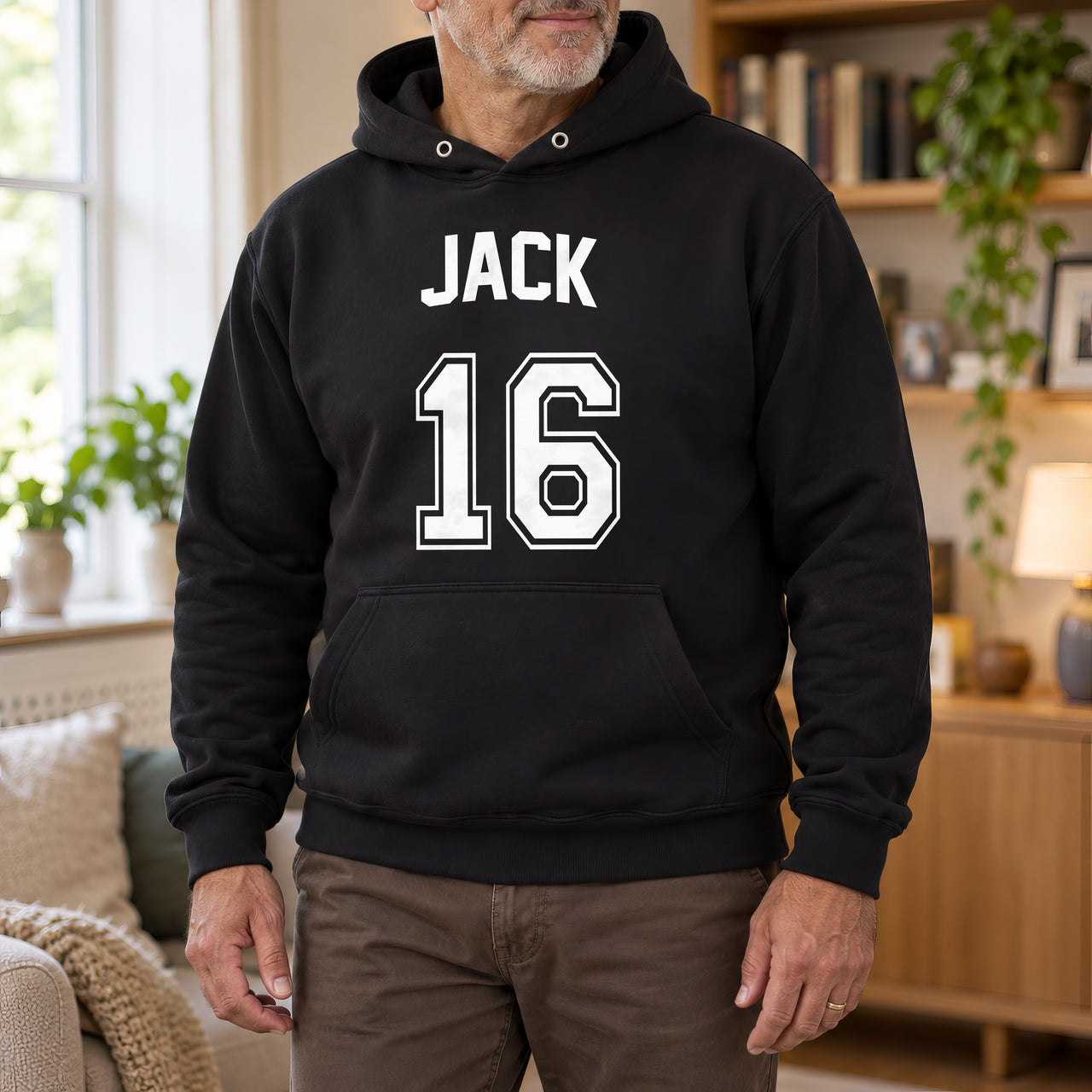 Black hoodie with the Birthday Jersey Name and Age design printed on the chest