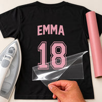 Black T-shirt back with pink 'EMMA' and varsity '18', name and number jersey iron-on transfer