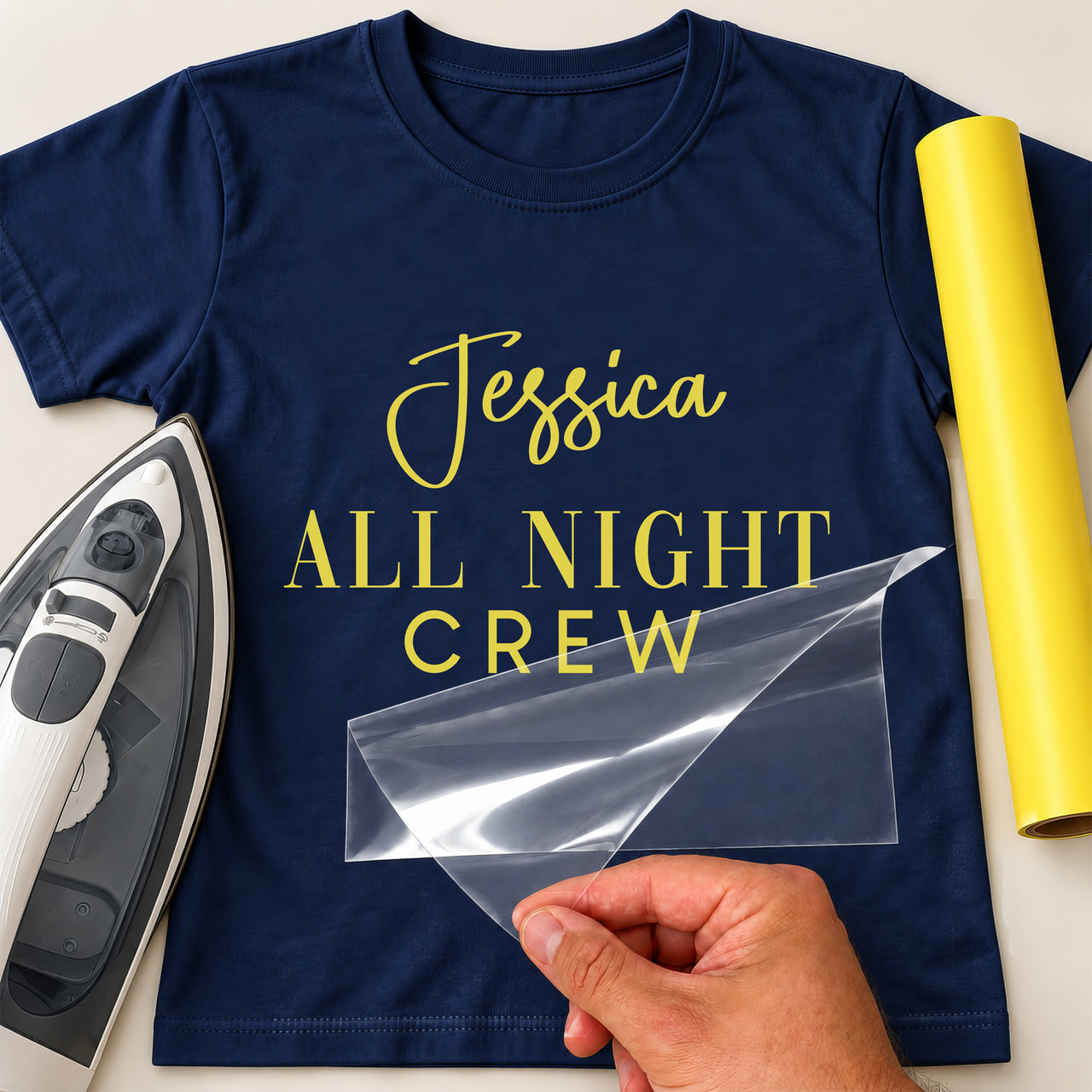 Neon rave iron-on text: yellow Jessica ALL NIGHT CREW on a navy T-shirt, film being peeled