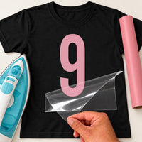 Black T-shirt with a large pink number '9' iron-on transfer, iron and pink vinyl roll for a ninth birthday