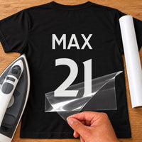 Basketball Vest Name Number iron-on transfer: white MAX 21 on a black T-shirt, film being peeled