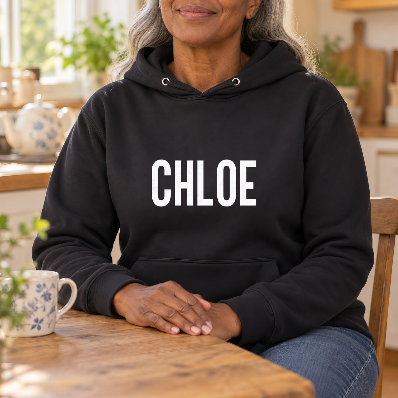 Personalised Carer Team Name Iron-On Transfer, shown on a black hoodie