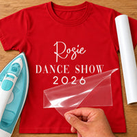 Dance Show 2026 iron-on transfer: white Rosie DANCE SHOW 2026 on a red T-shirt, film being peeled