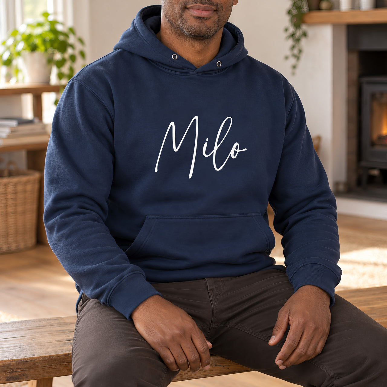Personalised Dog Bandana Name Iron-On Transfer, shown on a navy hoodie