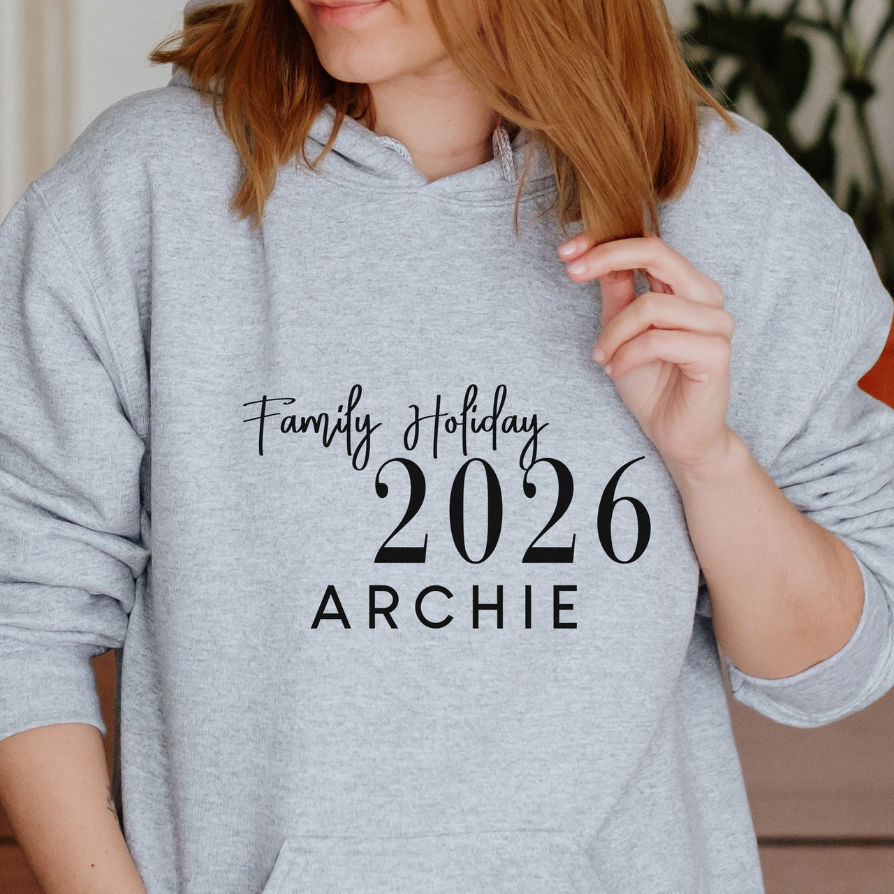 Personalised Family Holiday 2026 Iron-On Transfer shown on a hoodie