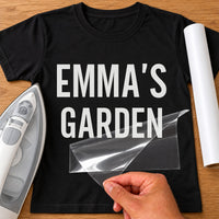 Black T-shirt with white 'EMMA'S GARDEN' in bold capitals, personalised garden name iron-on vinyl transfer