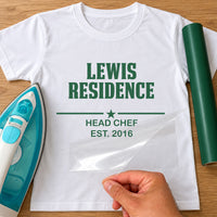 Head Chef residence iron-on transfer: green LEWIS RESIDENCE HEAD CHEF EST. 2016 on a white T-shirt, film being peeled