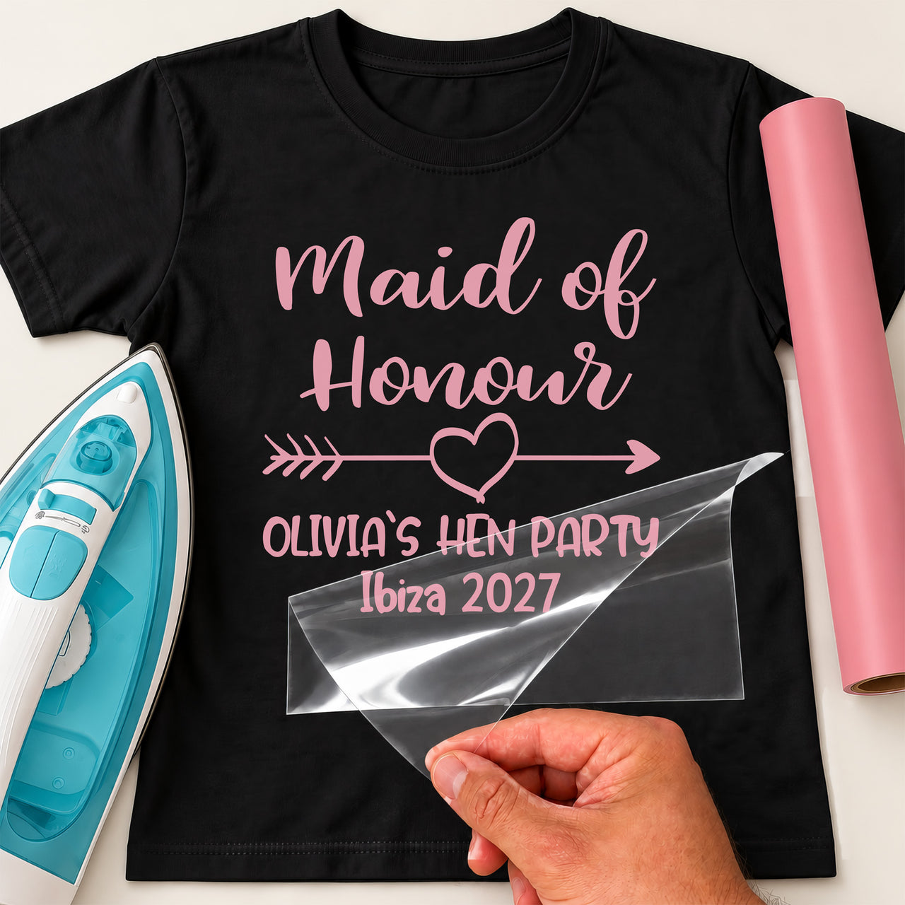 Black T-shirt with pink 'Maid of Honour', arrow heart, 'OLIVIA'S HEN PARTY Ibiza 2027' - iron-on vinyl transfer