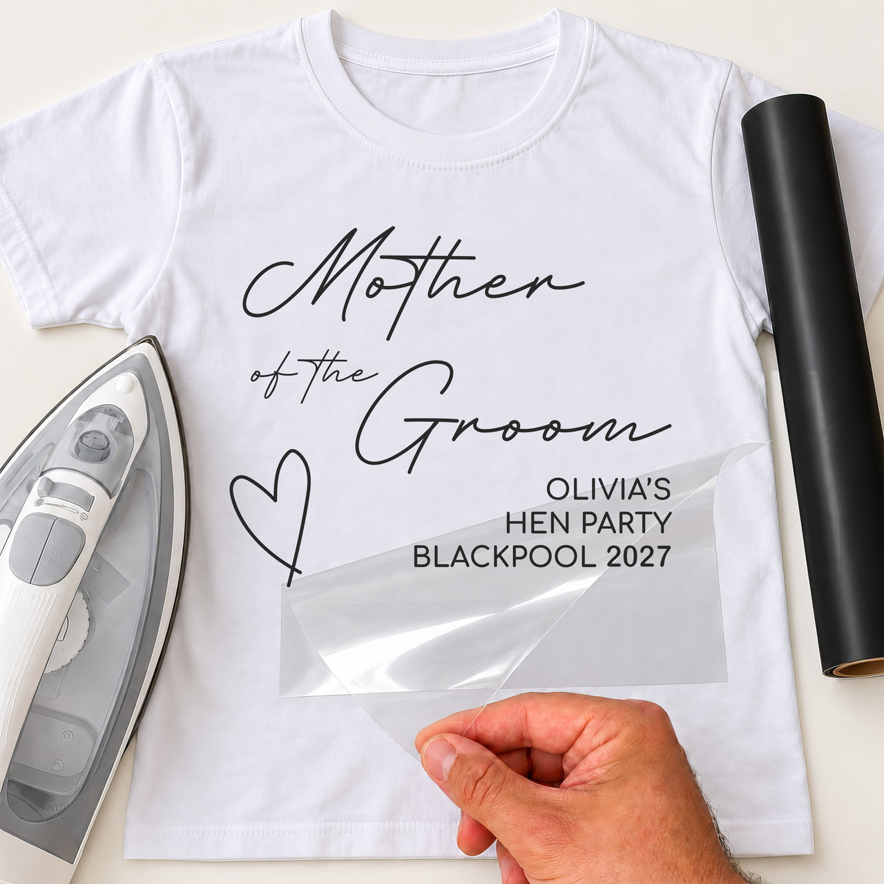 White T-shirt, black 'Mother of the Groom' and 'OLIVIA'S HEN PARTY BLACKPOOL 2027', film peeled - iron-on vinyl transfer