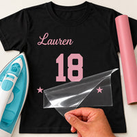 Black T-shirt with pink 'Lauren' script, varsity '18' and stars iron-on transfer, iron and pink vinyl roll