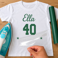 White T-shirt with green 'Ella' script, '40' and two stars iron-on transfer, iron and green vinyl roll