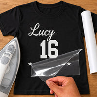 Black T-shirt with white 'Lucy' script, varsity '16' and two stars iron-on transfer, iron and white vinyl roll