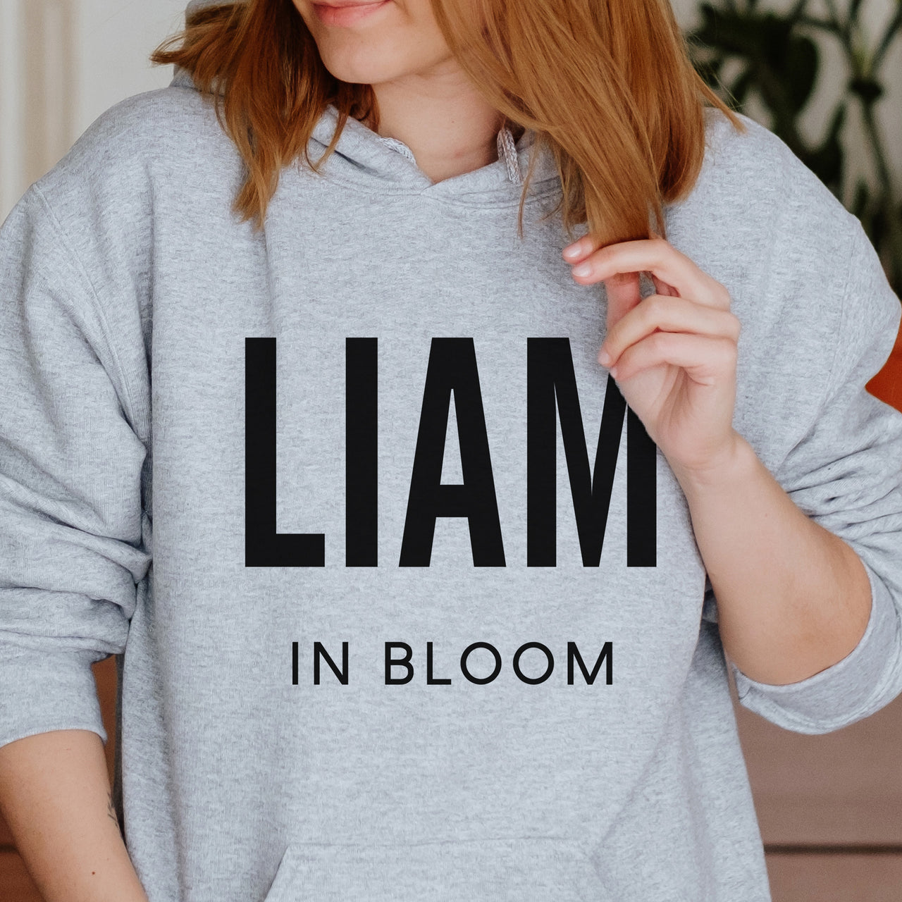 Personalised Name Iron-On Transfer - Wildflower Design shown on a hoodie