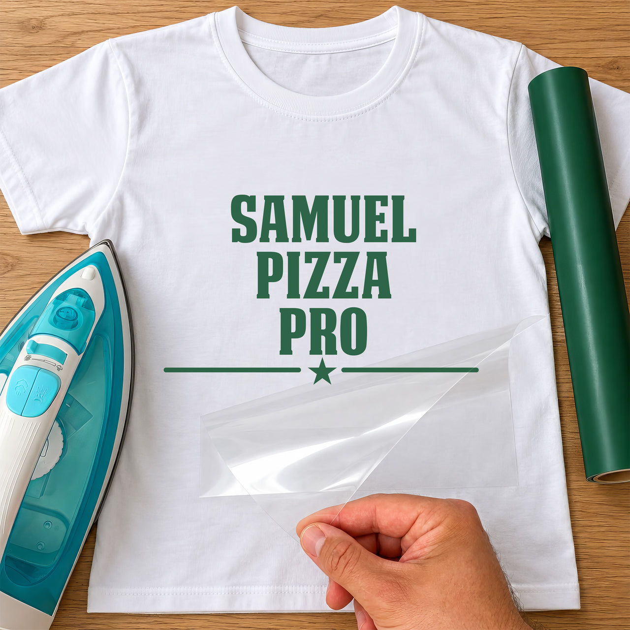 Green vinyl 'SAMUEL PIZZA PRO' with a star and line on a white T-shirt mockup, backing sheet peeled off