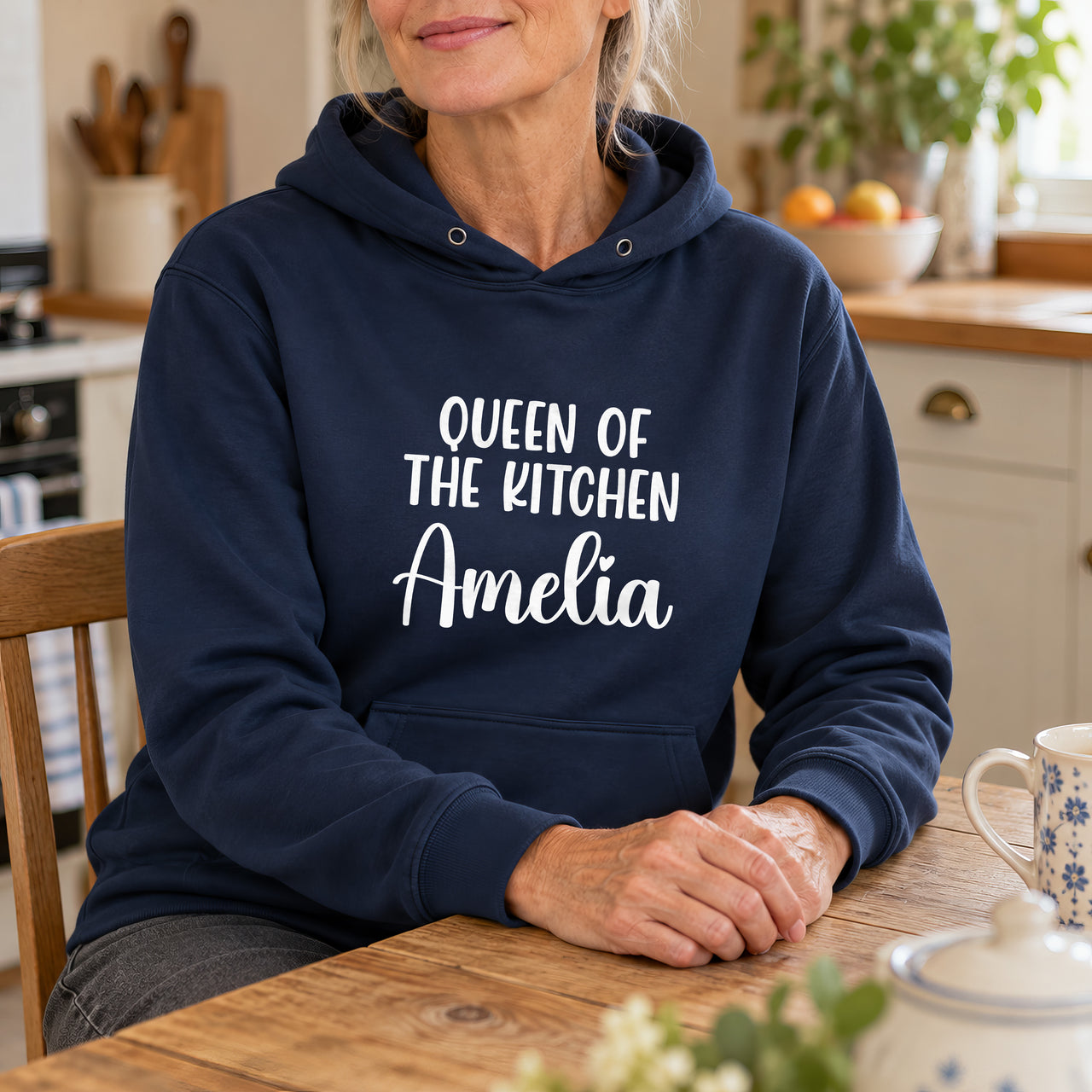 Queen Of The Kitchen Iron-On Transfer - Large Name Below, shown on a navy hoodie